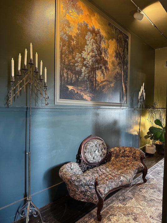 Vintage antique waiting room furniture in candlelight at a Denver spa