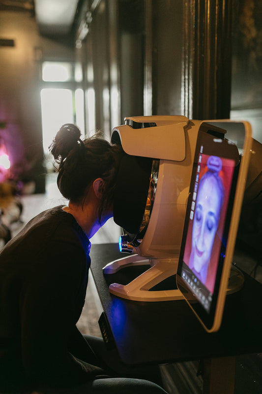 Women getting skin analysis at a spa in Denver co