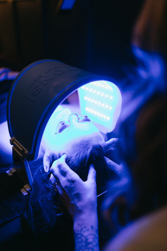 Blue light therapy panel being performed in a facial at the skin sanctum in Denver co