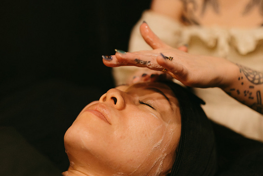Woman getting a facial at the skin sanctum in Denver colorado