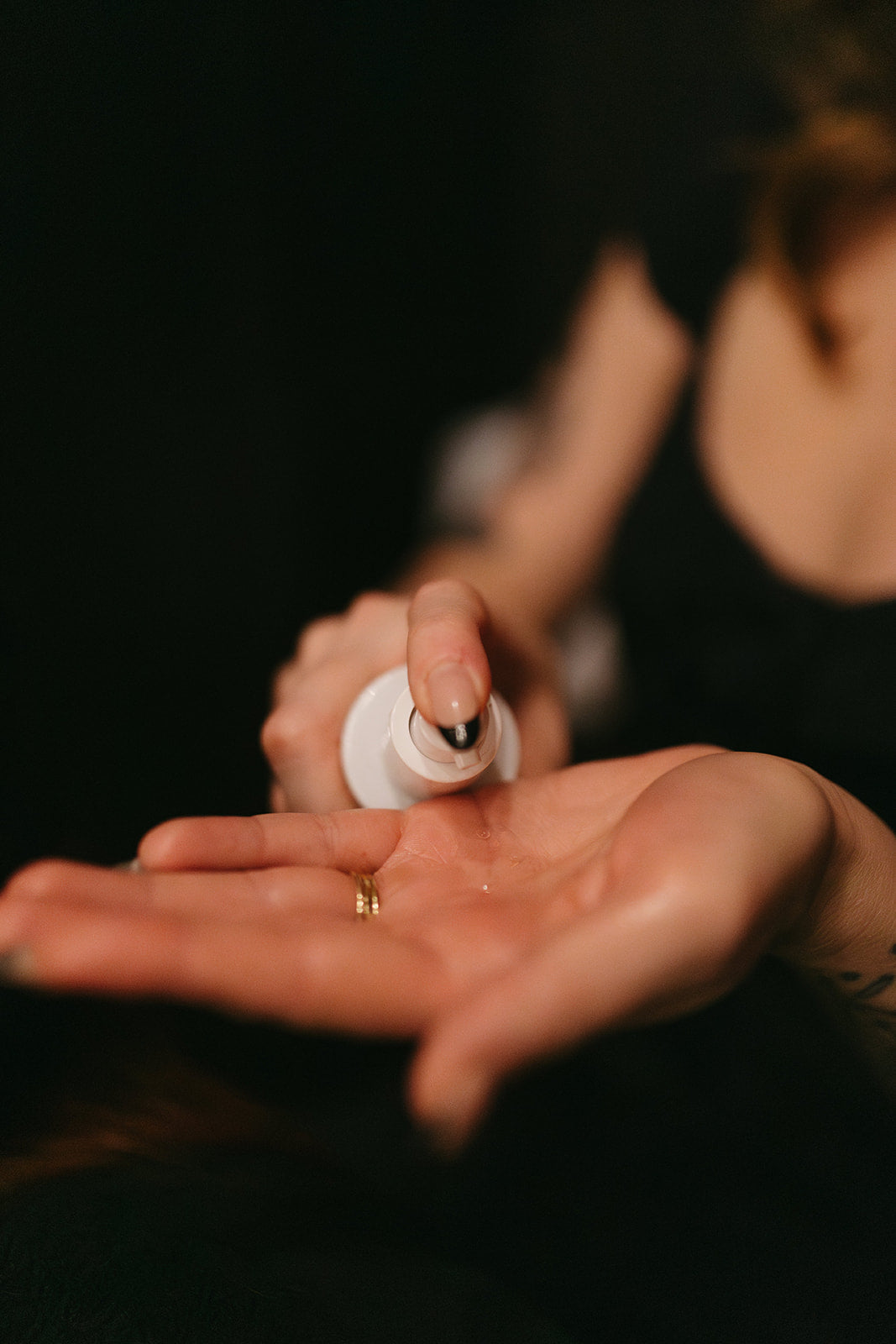 Cleanser being pumped into hand at the skin sanctum in Denver co