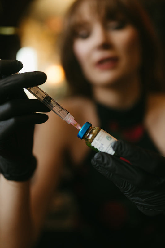 Custom chemical peel service at the skin sanctum in Denver co peel being drawn from vial with a needle