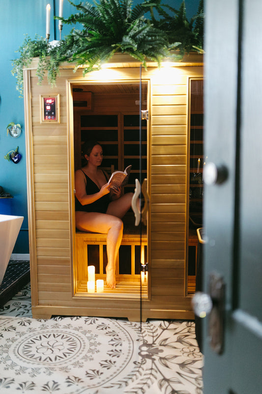 Woman reading in sauna at the skin sanctum in denver